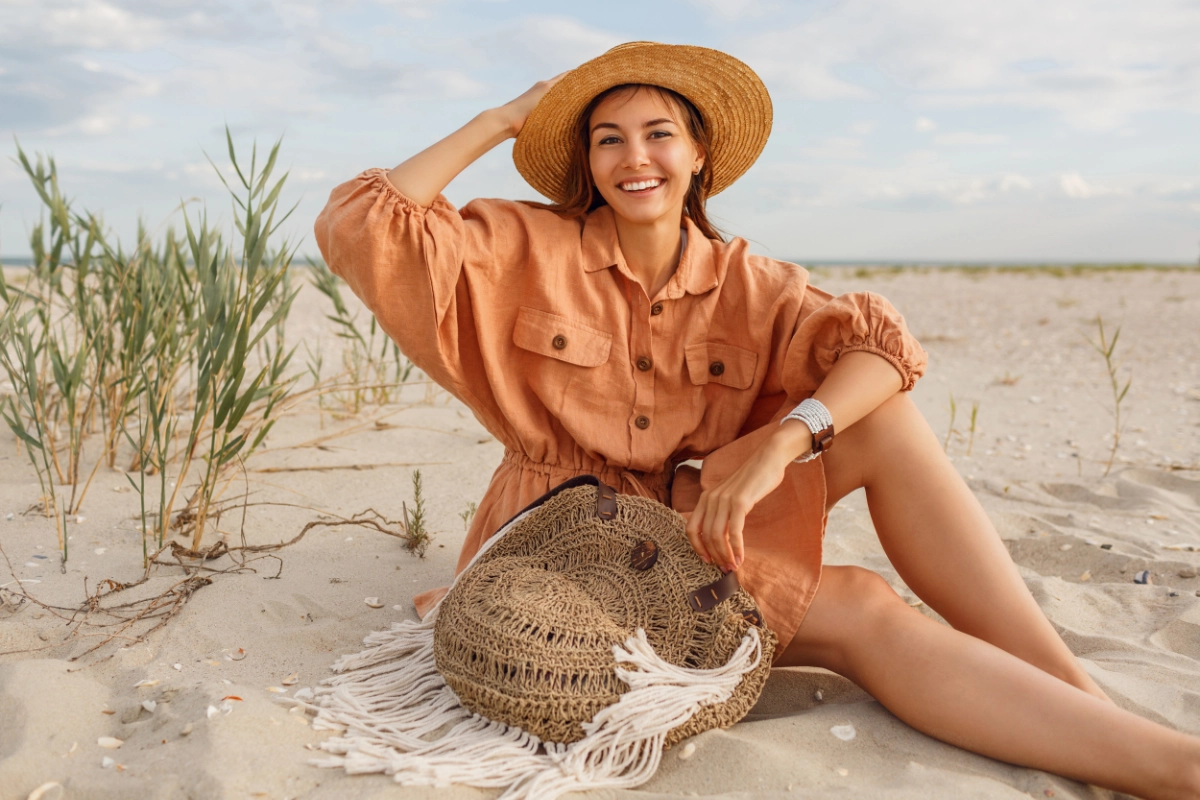 Woman In Orang Linen Outfit On Beach 1200X800