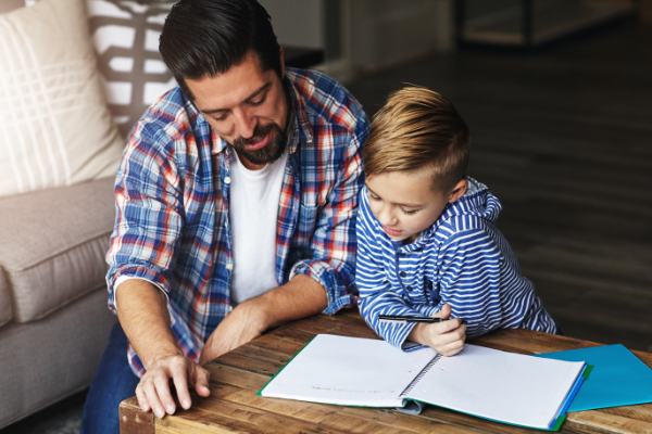 Father And Son Doing Homework 600X400